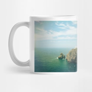 Lighthouse on top of a cliff Mug